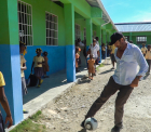 Gerard Butler playing soccer with schoolchildren in Haiti - Love Reaches Everywhere